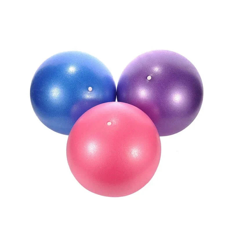 Three yoga balls, blue, purple, and pink