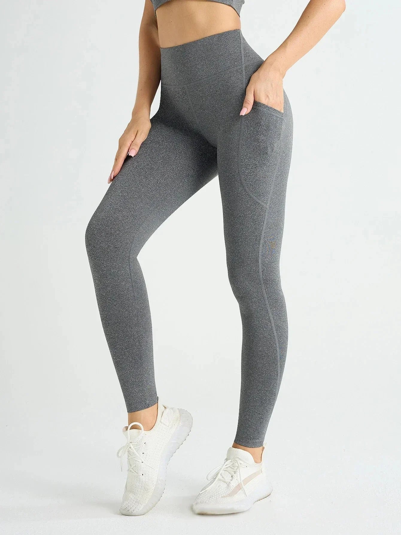 Women's high waist fitness leggings with pockets, stretch fabric, push-up design, solid color.