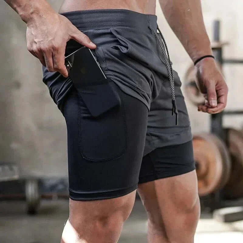Men's camo 2-in-1 running shorts with quick-dry fabric, shown being worn in a gym setting.