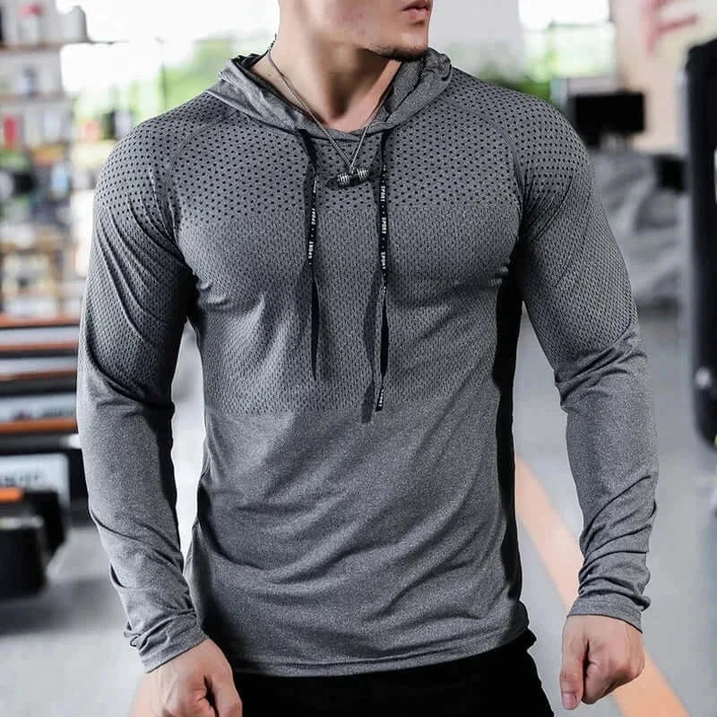 Men's fitness tracksuit with stylish hoodie and joggers for workout.