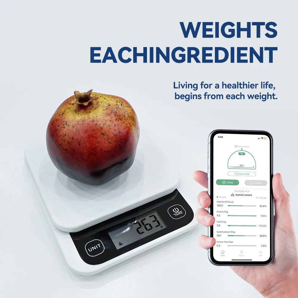 Smart nutrition scale weighing a fruit with smartphone app for tracking calories.