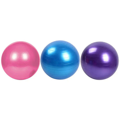 Three exercise balls in pink, blue, and purple